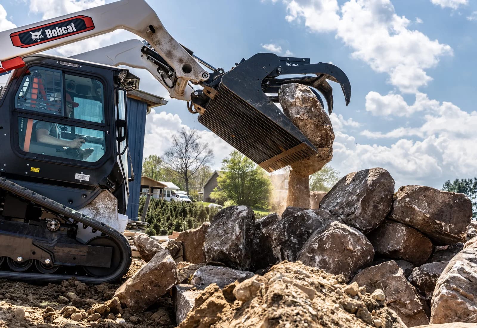 Bobcat compact track loader with grapple attachment